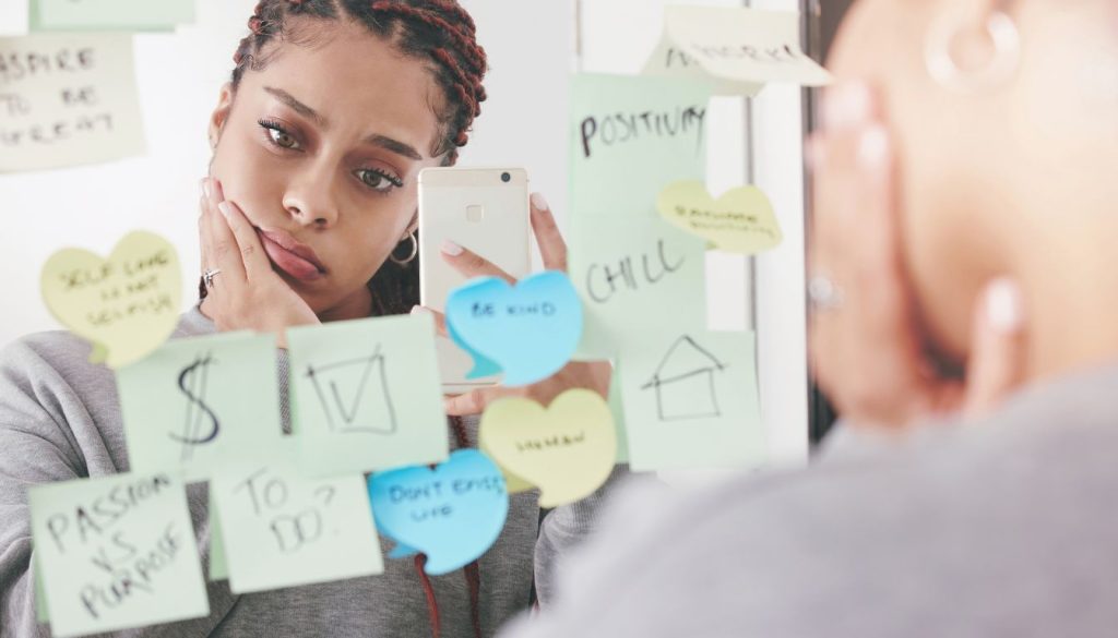 how-to-fight-negative-thoughts-and-feelings-Close-up-of-a-person-writing-positive-affirmations-and-positive-thinking-to-fight-negative-thoughts-and-feelings